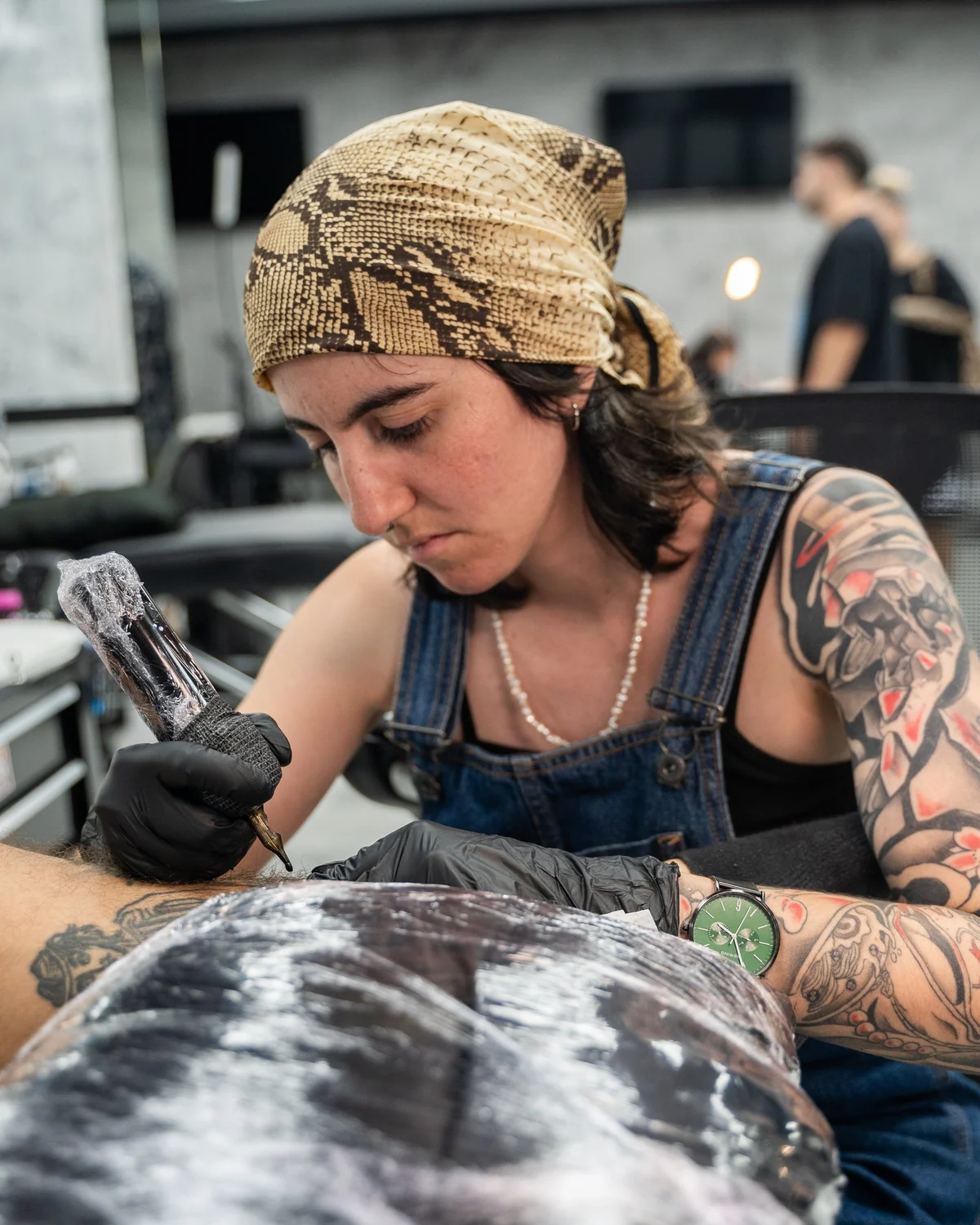 Andrea Ortega (Drew), tattoo artist en The Club Tattoo & Barber